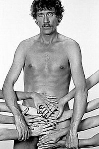 Porn star John Holmes naked with hands covering