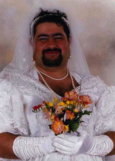 Bearded man in wedding gown